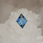 Load image into Gallery viewer, Montana Sapphire .78 CT Silvery Blue with Dark Blue Stripe Lozenge Cut
