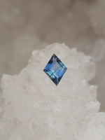 Load image into Gallery viewer, Montana Sapphire .78 CT Silvery Blue with Dark Blue Stripe Lozenge Cut
