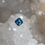 Load image into Gallery viewer, Montana Sapphire .64 CT Deep to Cornflower Blue with Purple and Gray Asscher Cut
