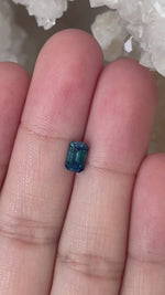 Load and play video in Gallery viewer, Montana Sapphire 1.25 CT Deep Blue Green Emerald Cut
