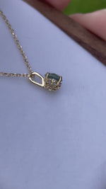 Load and play video in Gallery viewer, Montana Sapphire Necklace - Color Change Light Ocean Blue Green to Silvery Green Fleur De Lis Setting 14k Yellow Gold
