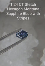 Load and play video in Gallery viewer, Montana Sapphire 1.24 CT Blue White Stretched Hexagon Cut
