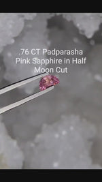 Load and play video in Gallery viewer, Montana Sapphire .76 CT Padparascha Half Moon Cut
