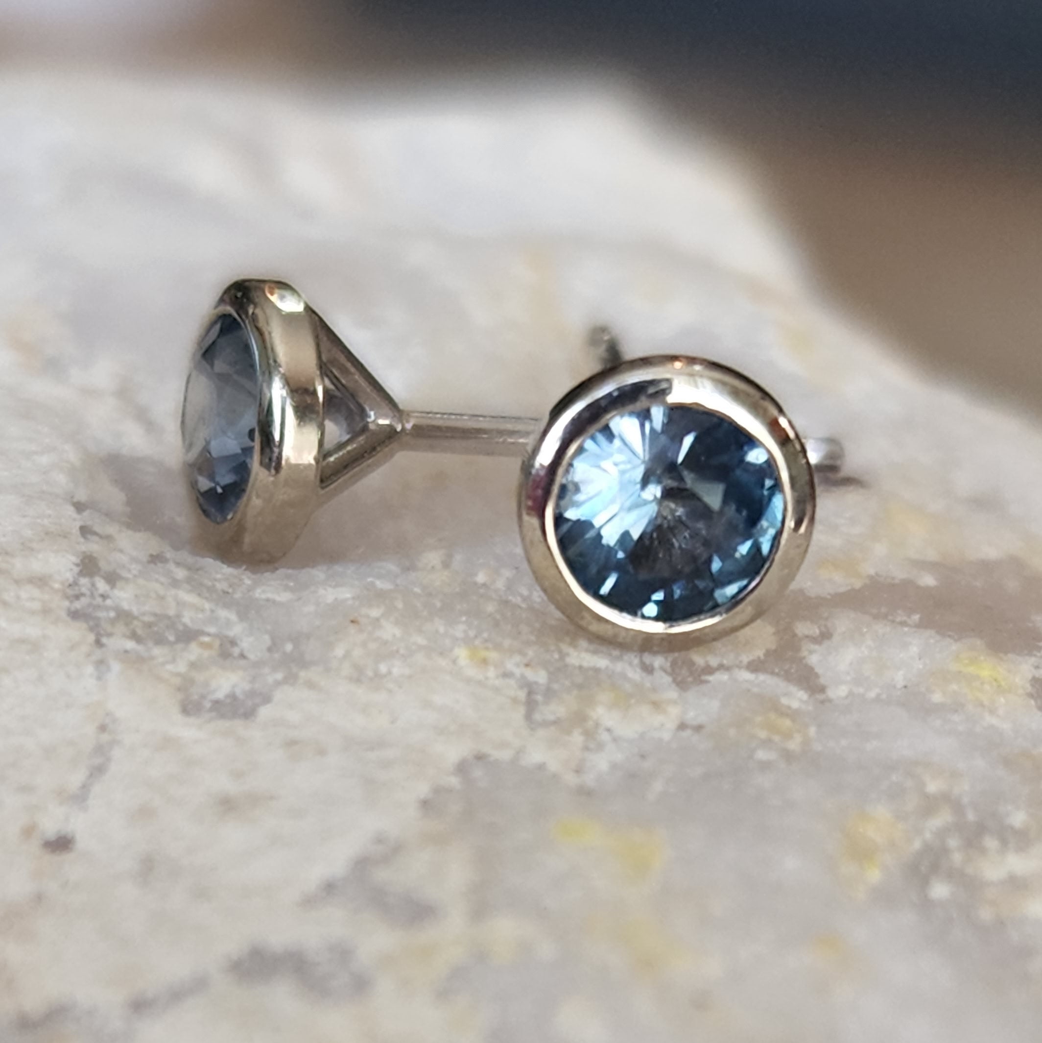 Earrings - Montana Sapphire .54 CTW teal blue bezel set in 14k White Gold