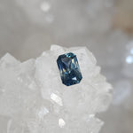 Load image into Gallery viewer, Montana Sapphire .91 CT Bluish Teal with Grey Scissor Cut
