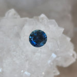 Load image into Gallery viewer, Montana Sapphire .78 CT Dark Teal Round Cut
