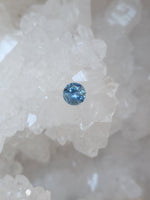 Load image into Gallery viewer, Montana Sapphire .57 CT Silvery Blue Round Cut
