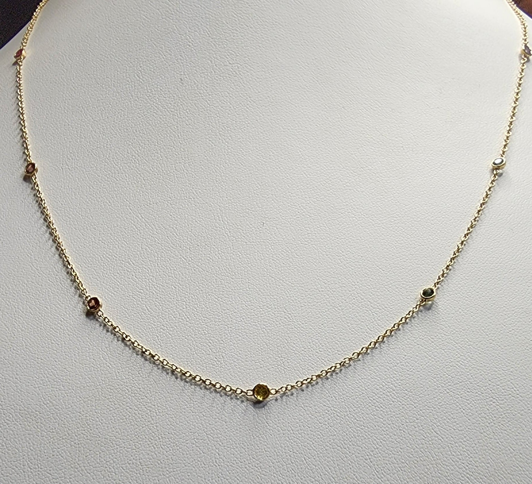 Necklace - Montana Sapphire .88 CTW 7 Rainbow Colored Rounds Bezel Mounted in 14K Yellow Gold