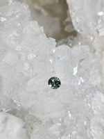 Load image into Gallery viewer, Montana Sapphire .31 CT Teal Round Cut
