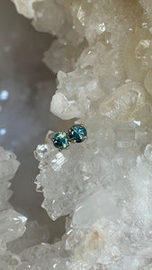 Earrings - Montana Sapphire .70 CTW Teal Round in 14k White Gold Fleur De Lis Detail Studs