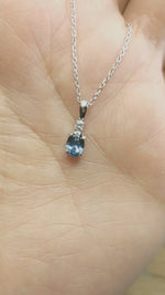 Load and play video in Gallery viewer, Pendant - Montana Sapphire .61 CT Blue Oval with Accent Diamond in 14k White Gold
