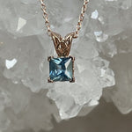 Load image into Gallery viewer, Pendant - Montana Sapphire .60 CT Blue Princess Cut set in 14k Rose Gold Scroll
