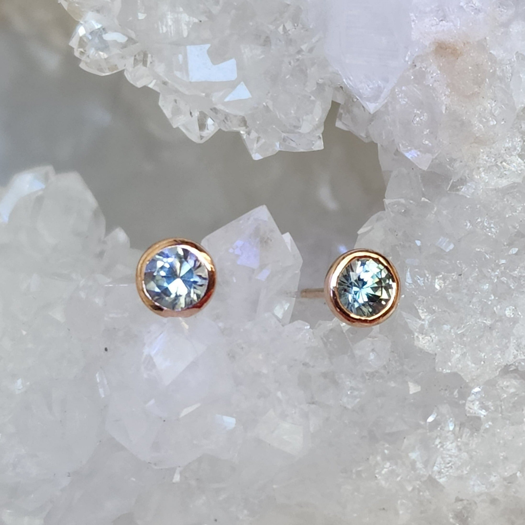 Earrings - Montana Sapphire .74 CTW Light Blue Round Cut in 14k Rose Gold Bezel Studs