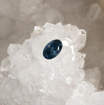 Load image into Gallery viewer, Montana Sapphire .98 CT Dark Blue, Silver with Hints of Gold Oval Cut
