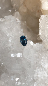 Montana Sapphire .98 CT Dark Blue, Silver with Hints of Gold Oval Cut