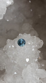 Load image into Gallery viewer, Montana Sapphire .87 CT Light Blue and Silver Round Brilliant Cut
