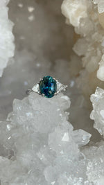 Load image into Gallery viewer, Ring - Madagascar Sapphire 3.26 CT Color Change Oval Cut Teal to Forest Green set in 14K White Gold and Triangle Diamond Ring
