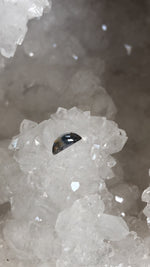 Load image into Gallery viewer, Montana Sapphire .53 CT Silver, Lavender, Peach, Light Blue and Green with RARE Garnet Inclusion Half Moon Cut - Collectable
